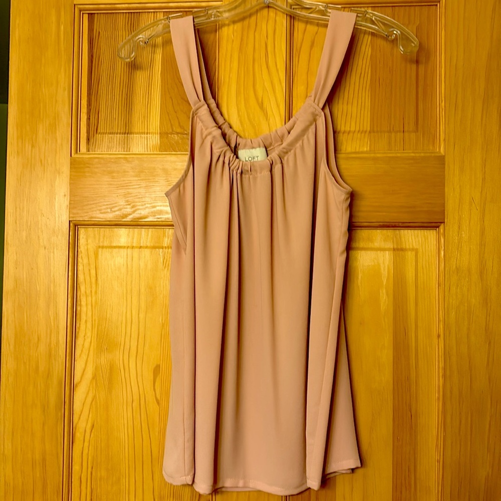 Pale pink sleeveless blouse